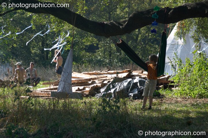 View through the trees in part of the healing field at the Turaya Gathering 2004. Wimborne, United Kingdom. © 2004 Photographicon