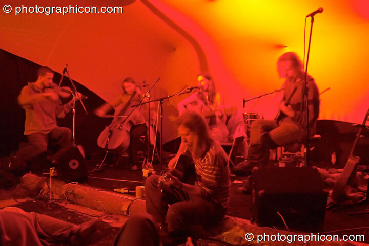 Martha Tilston and friends playing on the Small World Stage at the Turaya Gathering 2004. Wimborne, United Kingdom. © 2004 Photographicon