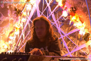 Naked Nick Holden DJing in the idSpiral cafe at the Turaya Gathering 2004. Wimborne, United Kingdom. © 2004 Photographicon