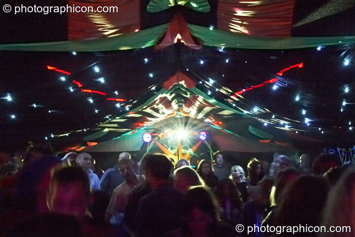 Dancers under simulated star field lighting in Tribe of Frog tent at Waveform Project 2007. Kenton, Exeter, United Kingdom. © 2007 Photographicon