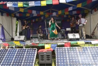 AMA play on the solar-powered World Stage at Kingston Green Fair 2004. Kingston Upon Thames, United Kingdom. © 2004 Photographicon