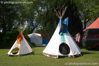 Two tipis basking in the sun at  Kingston Green Fair 2005. Kingston Upon Thames, United Kingdom. © 2005 Photographicon