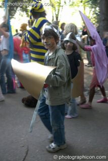 A boy in a cardboard knights outfit in the Carnival Procession at Kingston Green Fair 2005. Kingston Upon Thames, United Kingdom. © 2005 Photographicon