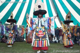 Tibetan monks of Tashi-Lhumpo perform a ritual costumed dance in the Sacred Dance tent at Kingston Green Fair 2007. Kingston upon Thames, United Kingdom. © 2007 Photographicon