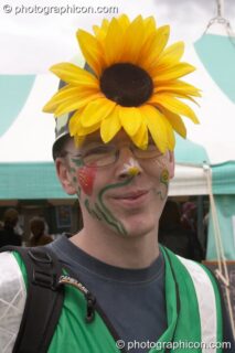 Howard Grange, Inspector of Green Police, wearing a large sunflower on his helmet at the London Green Lifestyle Show 2005. London, United Kingdom. © 2005 Photographicon