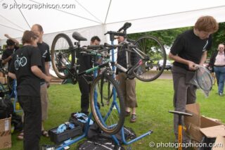Bike Doctor providing a free bicycle inspection service at the London Green Lifestyle Show 2005. London, United Kingdom. © 2005 Photographicon