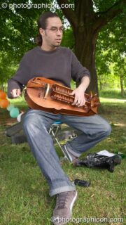 The Martin Harley Band play under a tree at the London Green Lifestyle Show 2005. London, United Kingdom. © 2005 Photographicon
