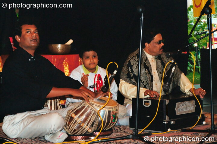Muscians from Bangladesh play spiritual sounds at Kingston Green Fair 2002. Kingston upon Thames, United Kingdom. © 2002 Photographicon