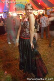 A woman poses In the Diner tent at the Lost Vagueness Summer Party 2004. Lewes, United Kingdom. © 2004 Photographicon