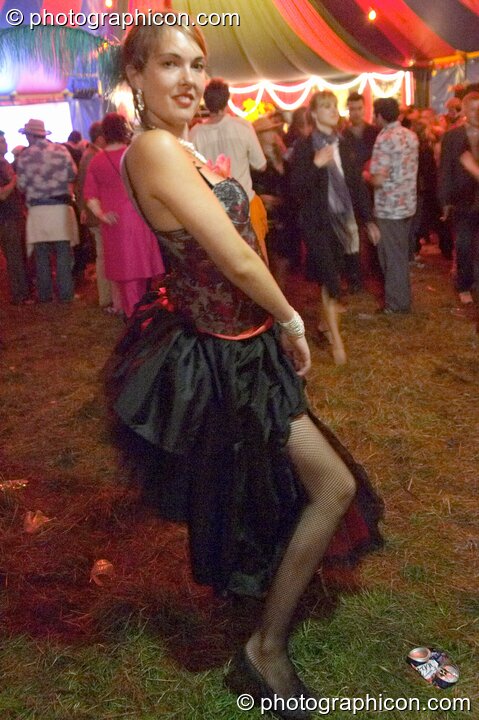 A woman poses In the Diner tent at the Lost Vagueness Summer Party 2004. Lewes, United Kingdom. © 2004 Photographicon