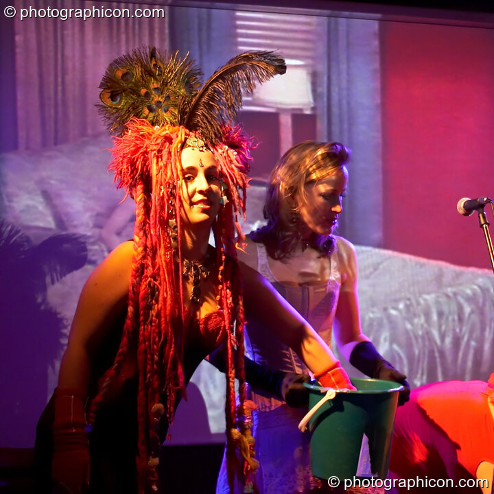 Kwali and Ellie draw raffle tickets at the Save The World Club Burlesque Ball. Kingston upon Thames, United Kingdom. © 2005 Photographicon