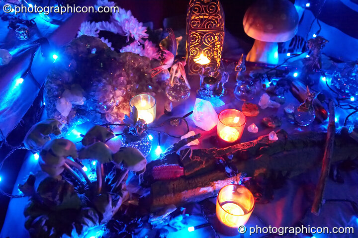 A wonderland of crystals and model fairies lit by small blue lights - decor part of the Omniscience Tea Stall at Chrysalid. London, United Kingdom. © 2006 Photographicon