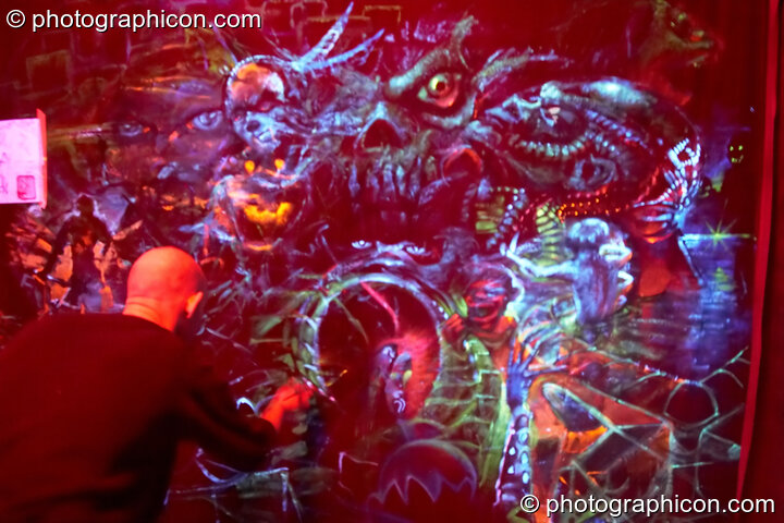 Dynamic backdrop artwork being painted by UV Lab (and passing guests) live in the anti-room at Chrysalid. London, United Kingdom. © 2006 Photographicon