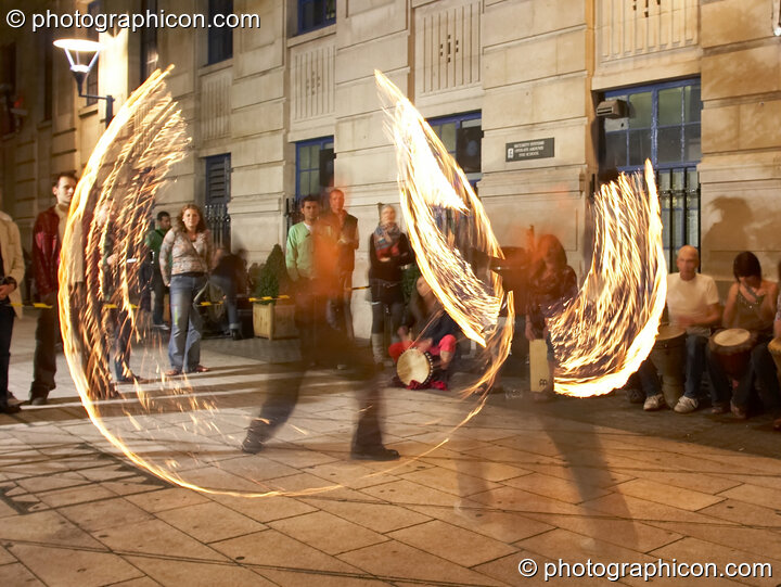 A fire-sabre performance by Jedi Jugglers outside the Kalahari party. London, United Kingdom. © 2006 Photographicon