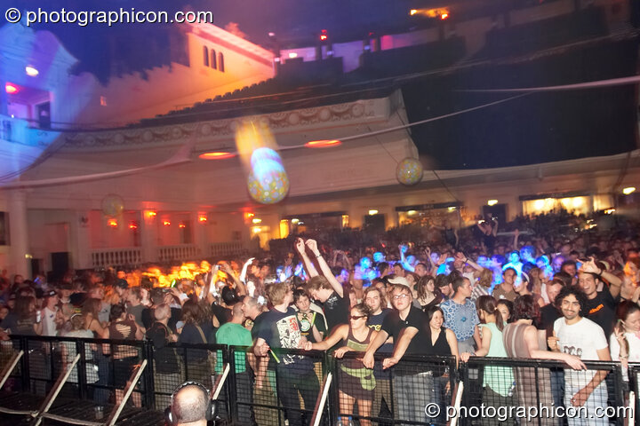 Dancers bounce large balloons around the Main Room at the Twisted Records concert. London, United Kingdom. © 2007 Photographicon
