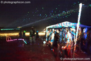 Lasers and Lights in the rain outside the Little Green Planet Stage at the Echo Festival. Overton, United Kingdom. © 2007 Photographicon