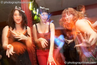 Three women dance at Saharawi, The Synergy Centre. London, United Kingdom. © 2007 Photographicon