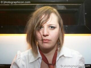 A woman stares for the camera at Dave Green's birthday party. London, United Kingdom. © 2007 Photographicon
