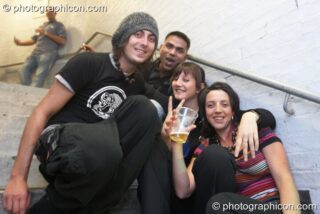 A group of friends chill on the stairs at Future Music. London, United Kingdom. © 2008 Photographicon