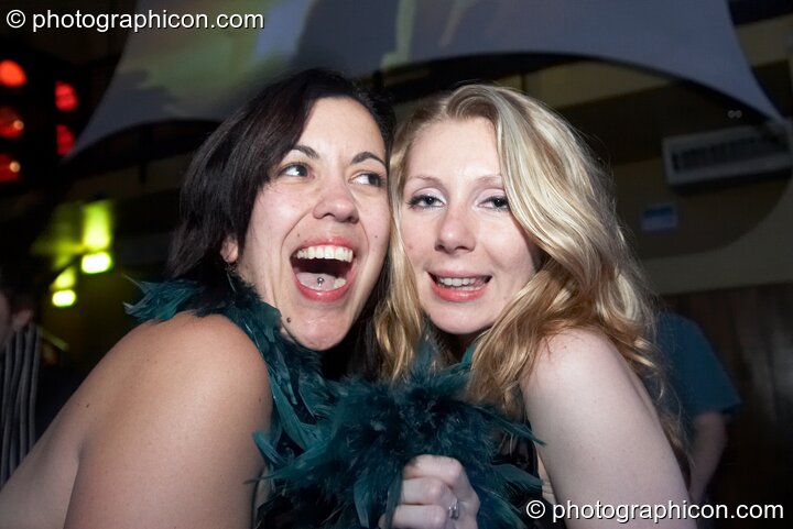Two women dance together in the Future Funk Room at Future Music. London, United Kingdom. © 2008 Photographicon