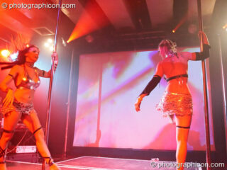 Terri Hosford and Ingrid of Fluorotrash perform psychedelic pole dancing on the Skandalous! stage at Electric Circus / Circus2Gaza. London, United Kingdom. © 2009 Photographicon