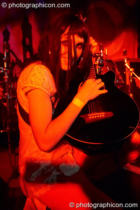 Noemie tunes her guitar in the Peppermint Hippo Rehab Clinic at the Electric Circus. London, United Kingdom. © 2010 Photographicon