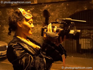 Rosie videos the proceedings at The Halloween of the Cross Bones XIII. London, United Kingdom. © 2010 Photographicon