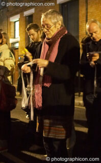 Participants read the names of the outcast dead outside the gates of the old Cross Bones graveyard at The Halloween of the Cross Bones XIII. London, United Kingdom. © 2010 Photographicon