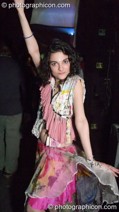 Woman stands on the catwalk modelling for an ethical fashion show at The Synergy Project. London, United Kingdom. © 2005 Photographicon