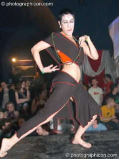 Woman stands on the catwalk modelling for an ethical fashion show at The Synergy Project. London, United Kingdom. © 2005 Photographicon