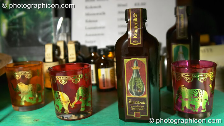 Decorated bottle of Indian tonic with matching shot glasses in IDspial cafe at The Synergy Project. London, United Kingdom. © 2005 Photographicon