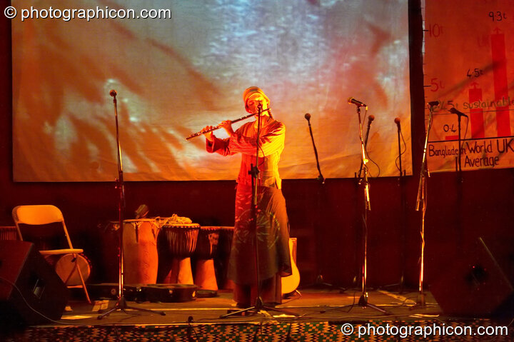 Loan flautist in the The Synergy Centre space at The Synergy Project. London, United Kingdom. © 2006 Photographicon