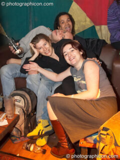 Revelers relax in the Small World Stage space at The Synergy Project. London, United Kingdom. © 2006 Photographicon