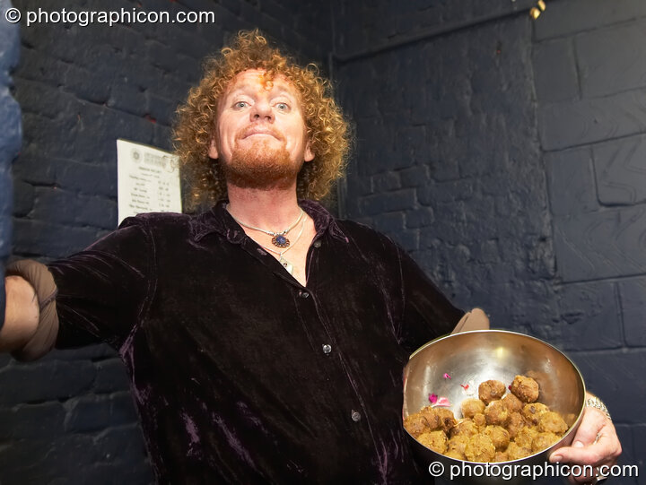 Mathura Das offers his special energy food at The Synergy Project. London, United Kingdom. © 2006 Photographicon