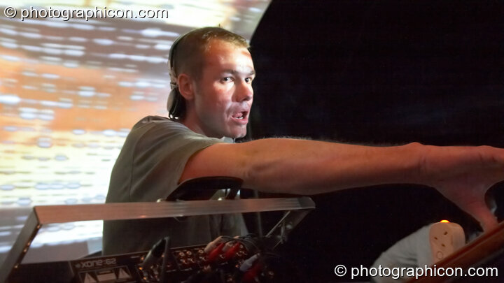 Agent Smith DJing on the Liquid Records stage with a projected backdrop by Inside-Us-All at The Synergy Project. London, United Kingdom. © 2006 Photographicon