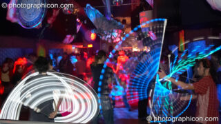 Jedi Jugglers spin their glow staffs in the Little Green Planet space at The Synergy Project. London, United Kingdom. © 2007 Photographicon