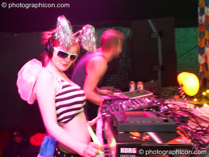 A random woman from the audience joins Telepathik behind the decks on the Kundalini stage at The Synergy Project. London, United Kingdom. © 2007 Photographicon