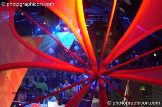 Dancers in the Liquid Records space seen through hanging decor at The Synergy Project. London, United Kingdom. © 2007 Photographicon
