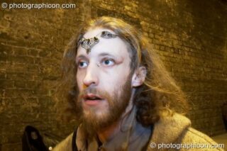 A man in the queue in the tunnel outside at The Synergy Project. London, United Kingdom. © 2007 Photographicon