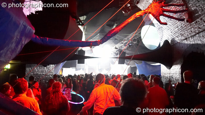 Dancers in the Kundalini room viewed through the arms of a giant marionette at The Synergy Project. London, United Kingdom. © 2008 Photographicon