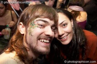 A man and woman cuddle in the Inspiration Hall at The Synergy Project. London, United Kingdom. © 2008 Photographicon