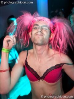 A man dressed in drag damces in the Events4Change / Nu-School Hippies room at The Synergy Project. London, United Kingdom. © 2008 Photographicon