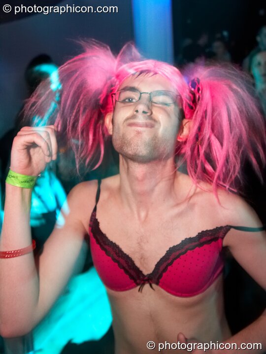 A man dressed in drag damces in the Events4Change / Nu-School Hippies room at The Synergy Project. London, United Kingdom. © 2008 Photographicon