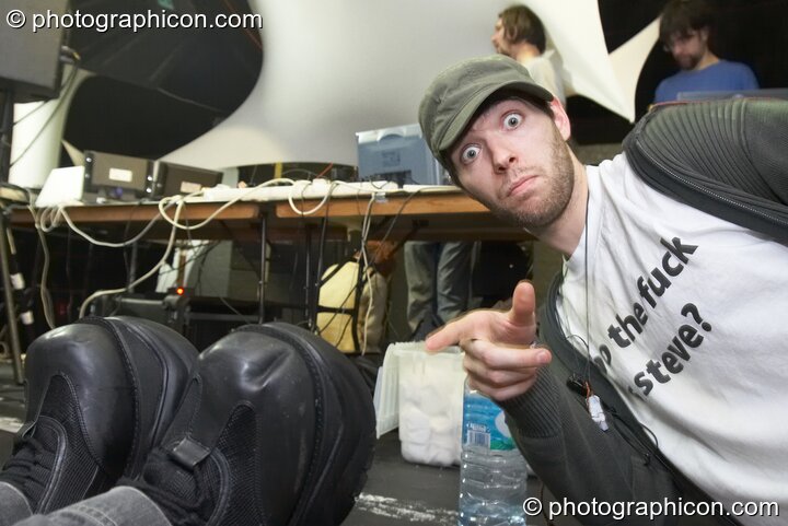 Giani points at the boots of Bruce Elliott-Smith backstage in the Events4Change / Nu-School Hippies room at The Synergy Project. London, United Kingdom. © 2008 Photographicon