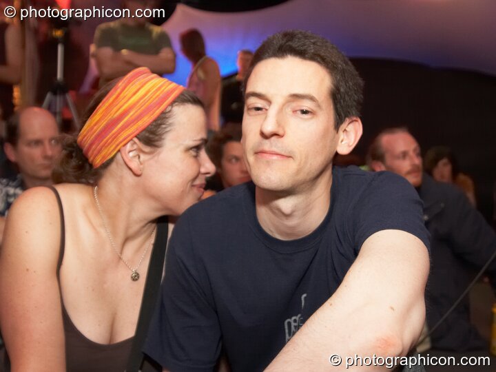 A man and woman snuggle in the Inspiration Hall at Luminopolis (formerly The Synergy Project). London, United Kingdom. © 2008 Photographicon