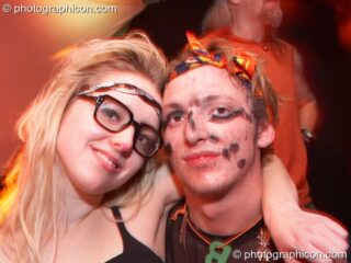 A woman hugs her boyfriend with a messy face in the Furthur Project room at Luminopolis (formerly The Synergy Project). London, United Kingdom. © 2008 Photographicon