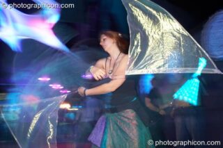 A woman twirls flags in the Liquid Records room at Luminopolis (formerly The Synergy Project). London, United Kingdom. © 2008 Photographicon