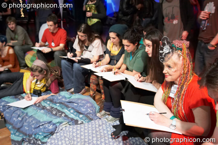 People sit and draw during Wendalena's portraiture workshop in the inSpiral Lounge at Luminopolis (formerly The Synergy Project). London, United Kingdom. © 2008 Photographicon