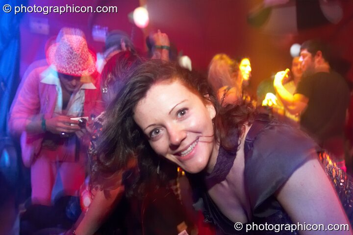 A woman dances in the Fish Seeks Bicycle room at Luminopolis (formerly The Synergy Project). London, United Kingdom. © 2008 Photographicon