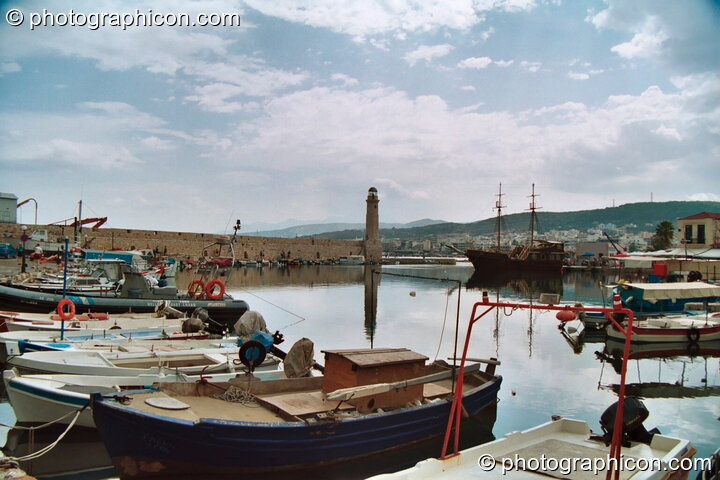 Boats and buildings reflected in the water of the harbour at Rethymno. Rethymno, Greece. © 2002 Photographicon